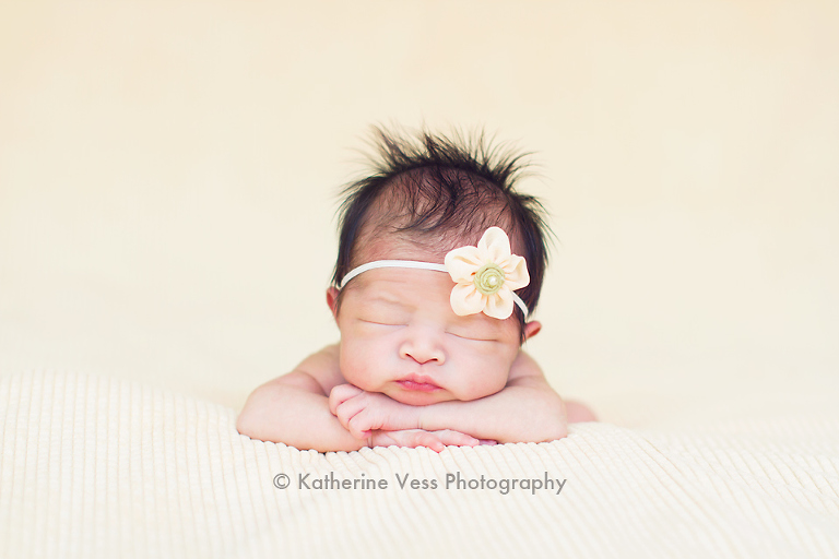 cute newborn baby girl with flower headband