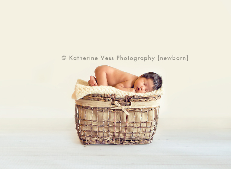 cute baby girl on picnic basket