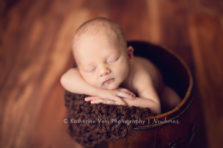 newborn in bucket