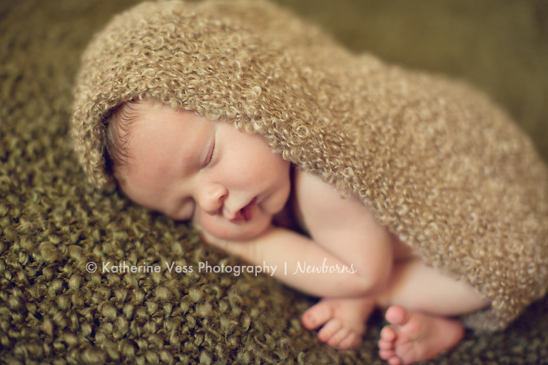 newborn taco pose, wrapped