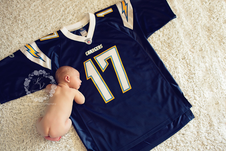 newborn with football jersey