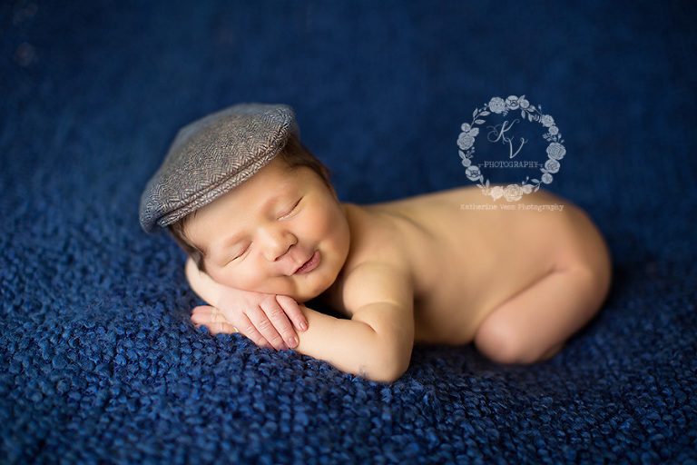 newborn in newsboy hat