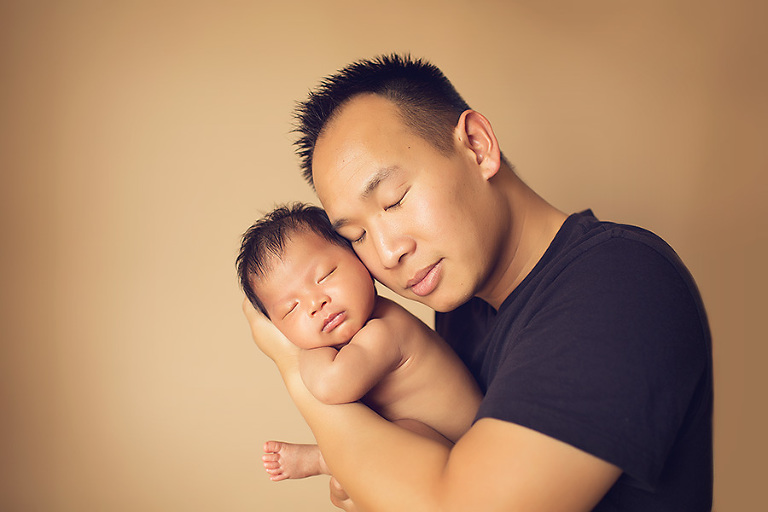 baby girl in daddy's arms