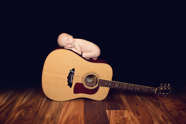 newborn on guitar composite