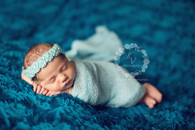 newborn girl on blue