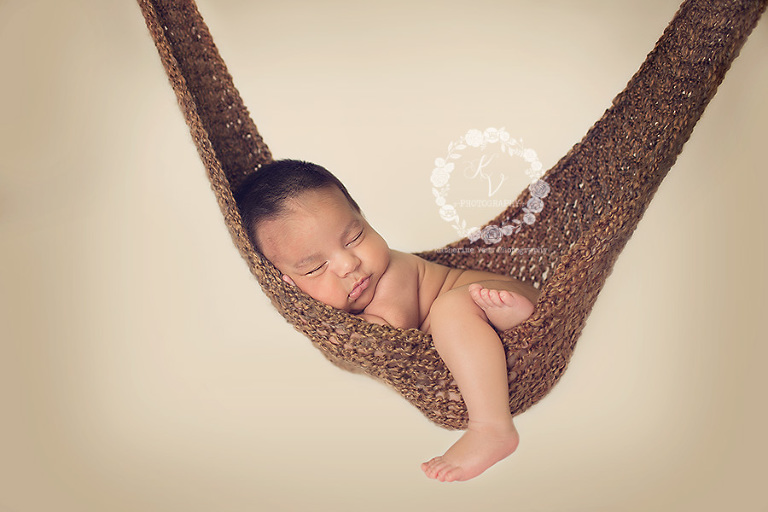 newborn in hammock