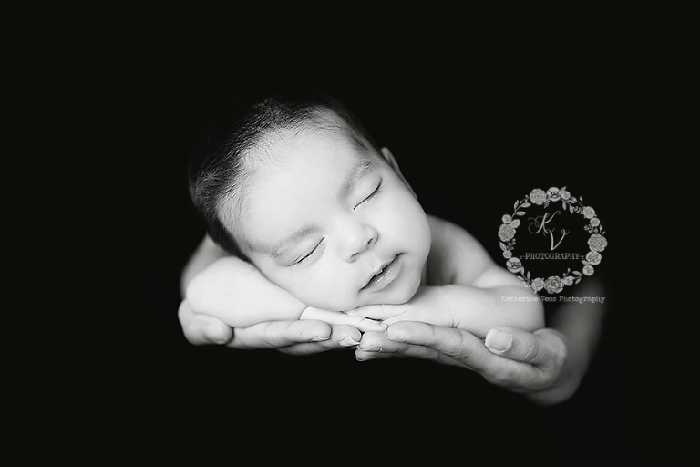 newborn in mom's hands