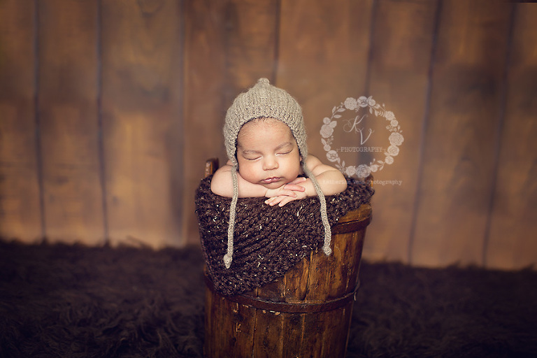 newborn in bucket