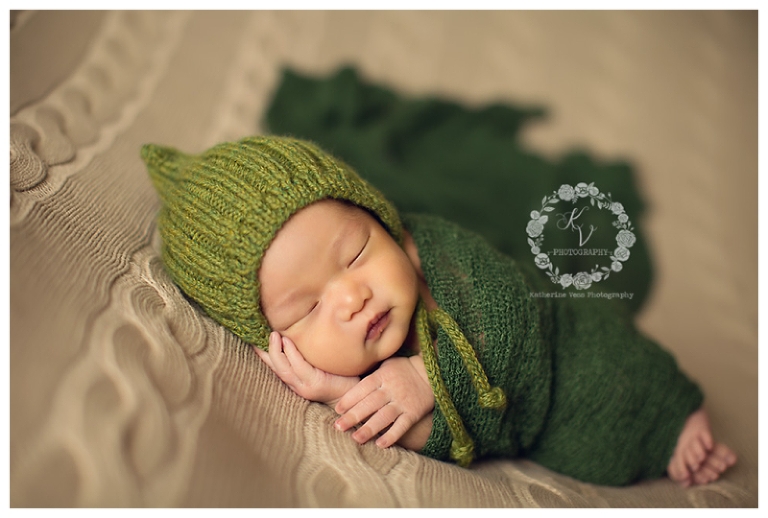 newborn boy in green