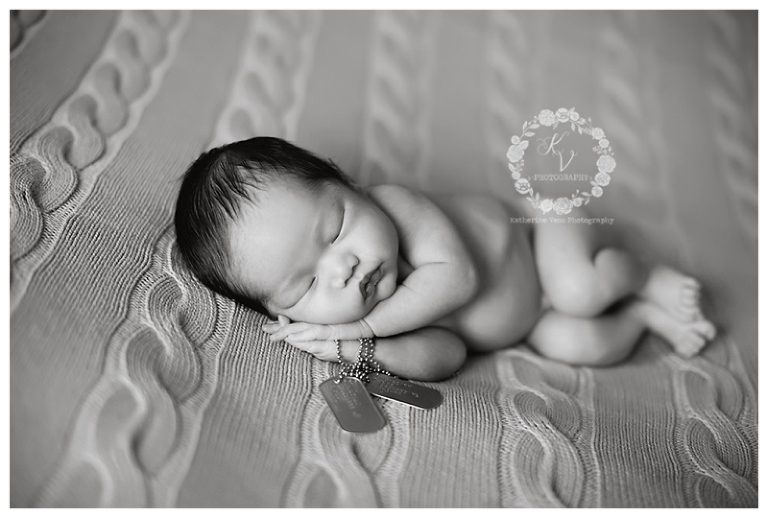 newborn with military dog tags