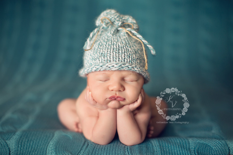 newborn chin in hands