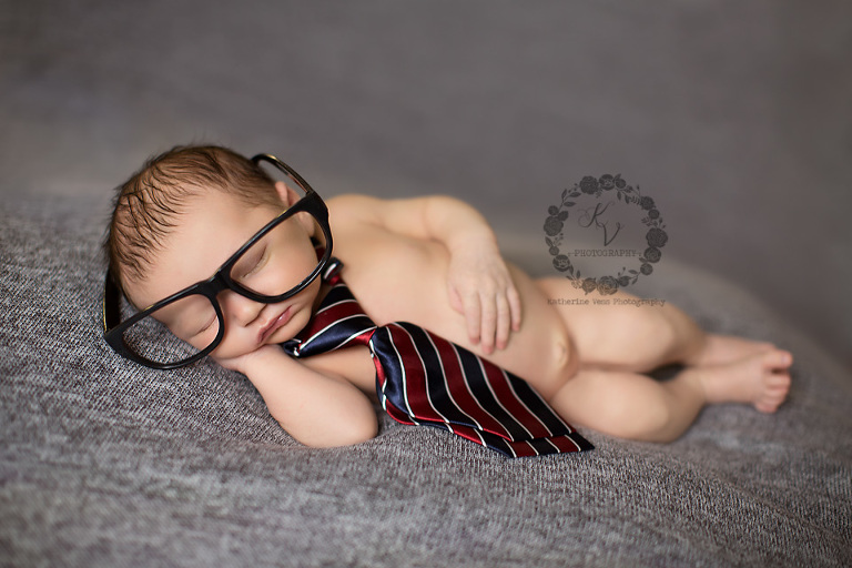 newborn with tie and glasses