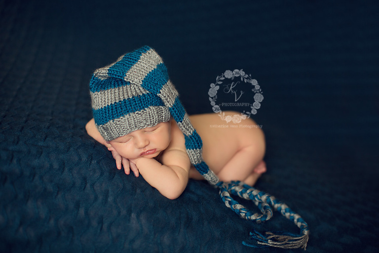 newborn with sleepy hat