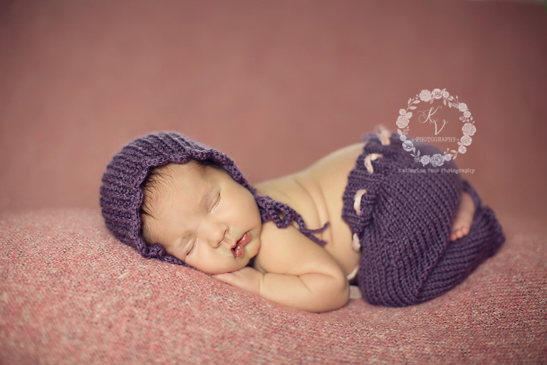 baby girl in bonnet and pants