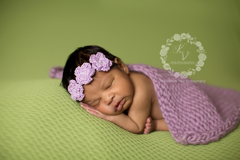 baby girl in green and lavendar