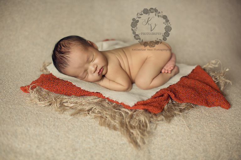 baby boy on burlap layers