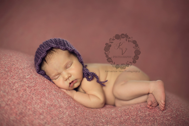 baby girl in purple bonnet