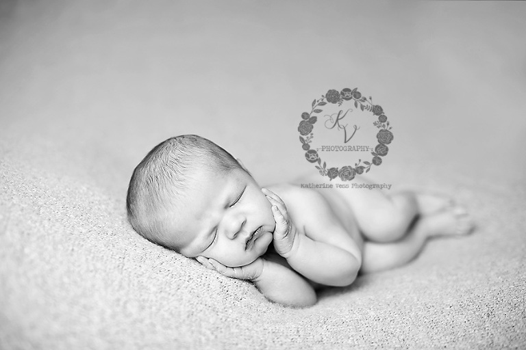 newborn side laying pose, black and white