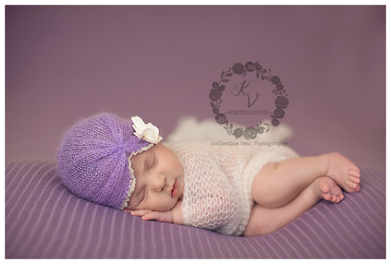 newborn wrapped on lavender