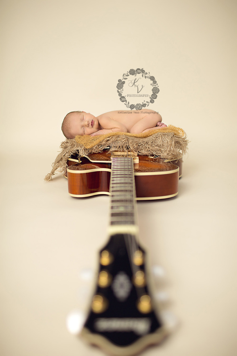 newborn on guitar