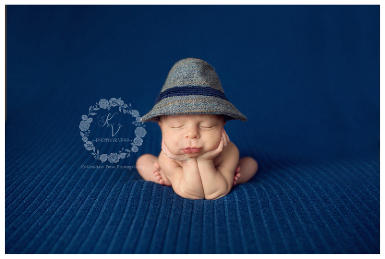 newborn boy with dapper hat