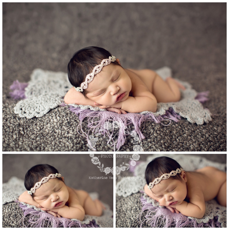 newborn girl on gray and lavender