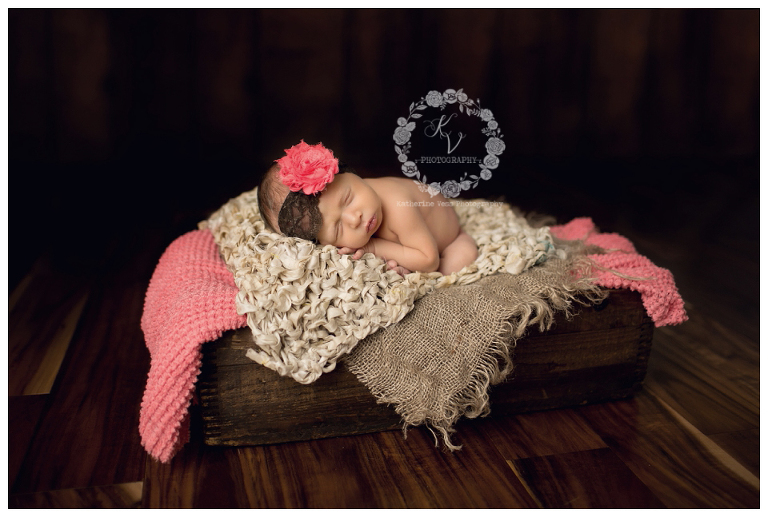 baby girl in coral and brown