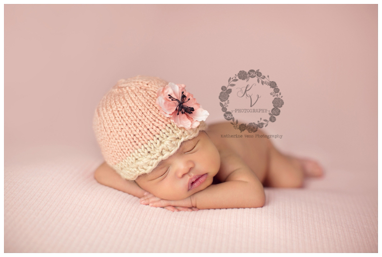 newborn head up pose, with hat