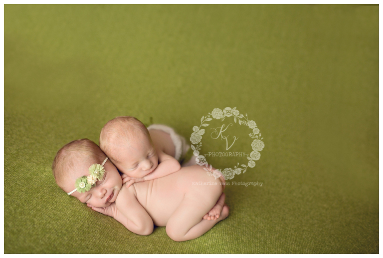 newborn twins on green